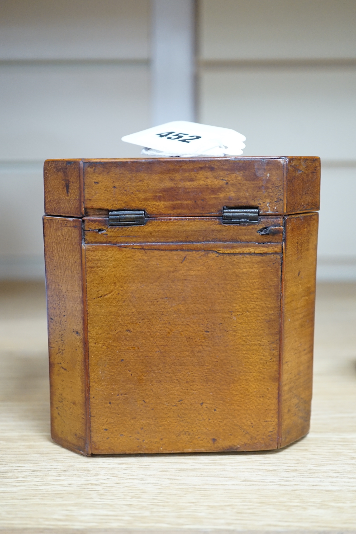 A George III octagonal shell marquetry tea caddy, 12.5cm high